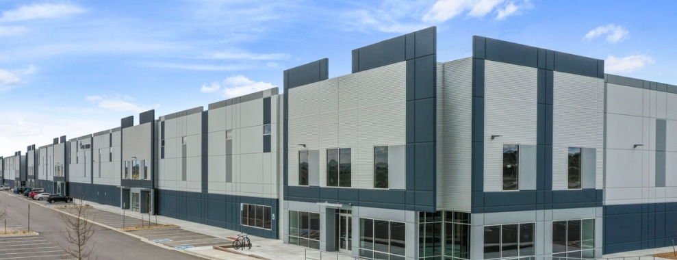 A modern multi-story building with geometric design and large windows