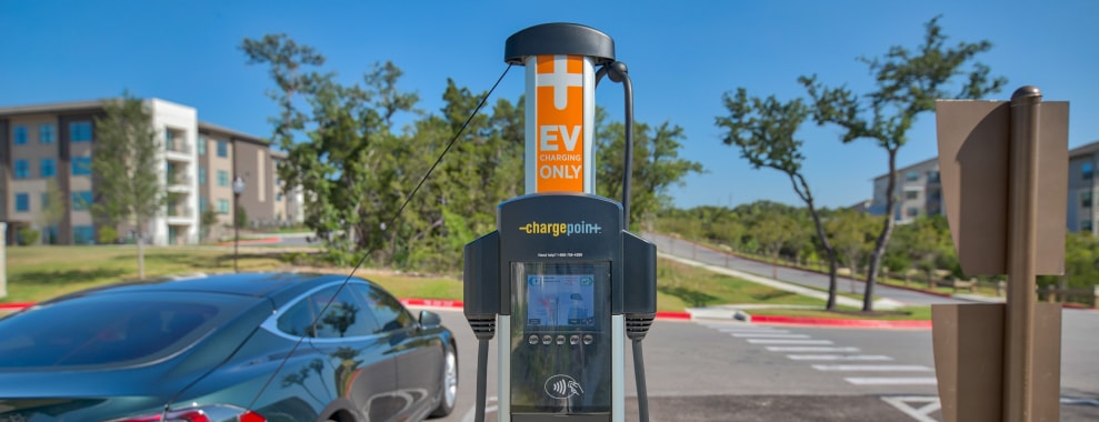 An electric vehicle parked at an EV charging point