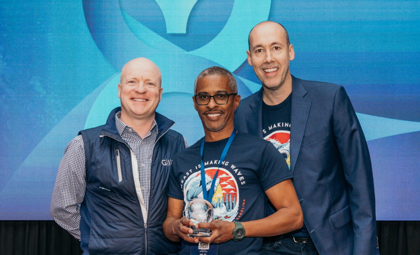 Three individuals holding the Responsible Investments Award