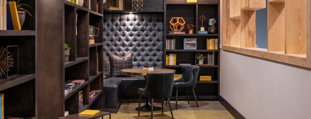 An interior space with a focus on seating and shelving area